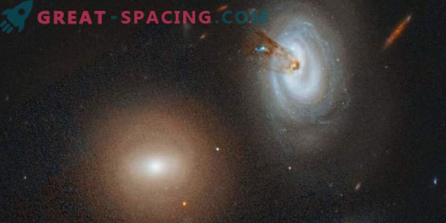 Un cluster flămând absoarbe o galaxie fără apărare
