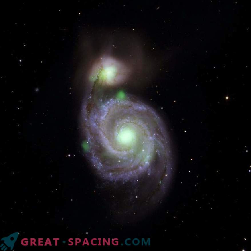 Un mic obiect luminos eclipsă găurile negre supermassive într-o confluență galactică