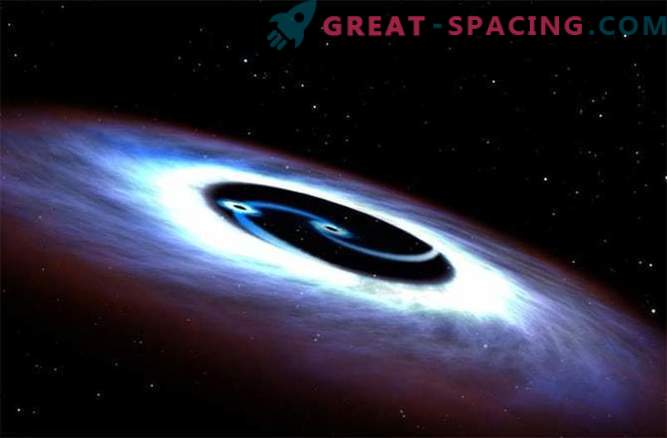 Găurile negre se rotesc în jurul unui quasar într-o bătălie mortală